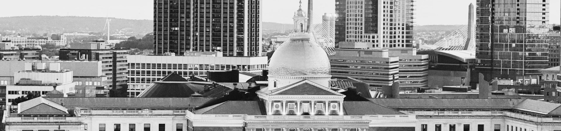 The Massachusetts State House dome against the Boston skyline